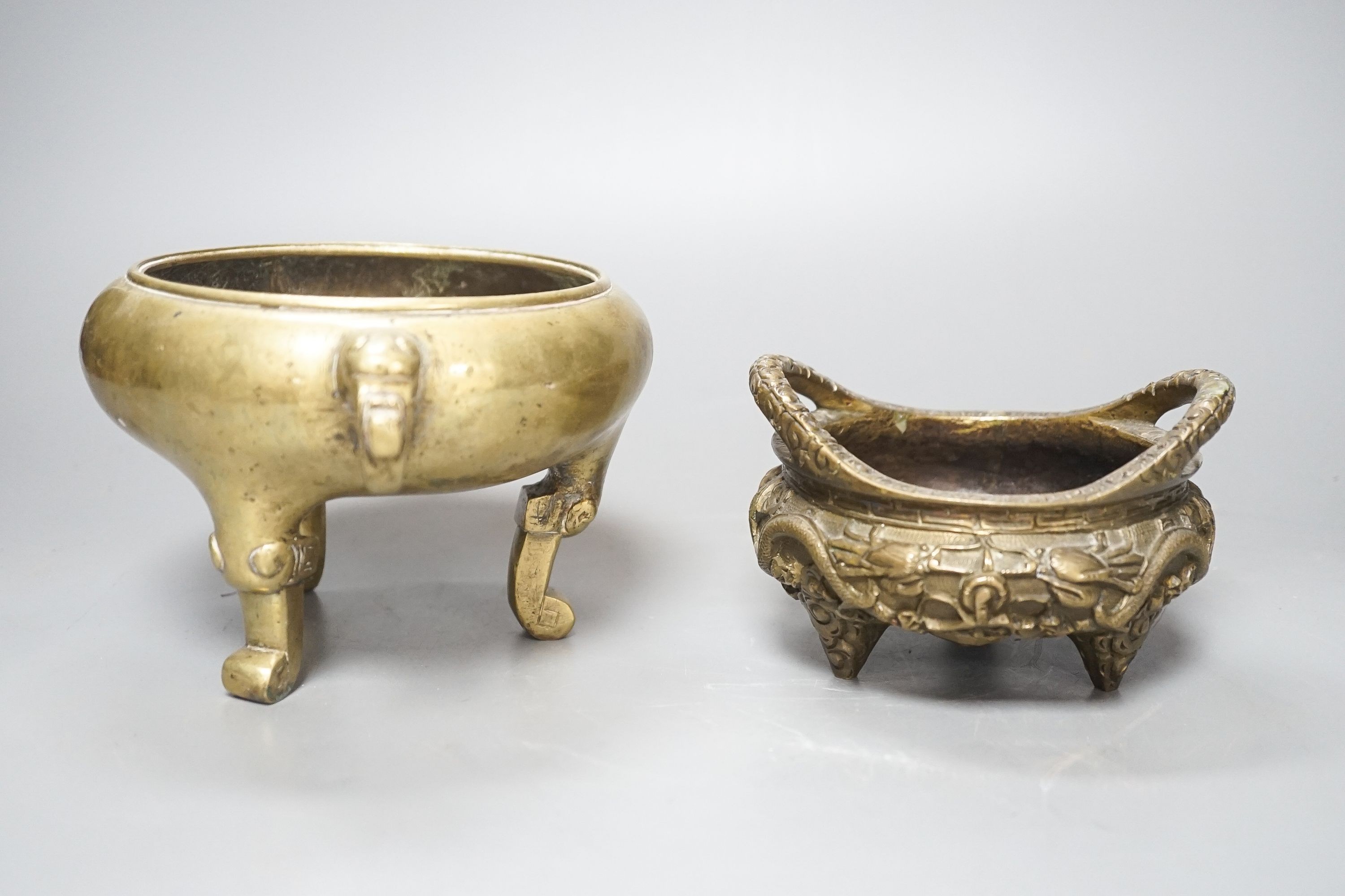 Two Chinese bronze tripod censers, Xuande marks but early 20th century, largest 21cm wide